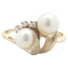 Material: 10K yellow gold Pearl: 6.50mm akoya Diamond: 3 round brilliant cut = .05cttw Color: H Clarity: SI1 Ring Size: 8.5 (please allow two additional shipping days for sizing requests) Dimensions: ring measures 13.30mm wide Weight: 3.59 grams Bypass Ring, Akoya Pearls, Pearl Diamond, Gold Pearl, Pearl Ring, Round Brilliant, Fashion Rings, Jewelry Rings, Pearl Earrings