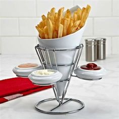 a basket filled with french fries sitting on top of a table