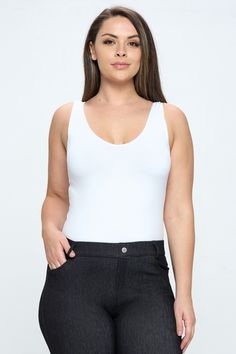 This seamless tank makes styling any outfit a breeze! Featuring a v-neckline and fitted silhouette in a buttery, soft fabric that's very comfortable for wearing all day.• Wide shoulder straps• V-neckline• Back scoop neck• Fitted silhouette• Seamless design• Buttery soft fabrication with stretch• Pull on/off• Longline hem• 92% Nylon, 8% Spandex White Stretch V-neck Camisole, Basic Stretch V-neck Tank Top, White Elastane Camisole Tank Top, White Elastane Tank Top, White Stretch Camisole, White Stretch Elastane Camisole, Seamless V-neck Summer Tops, Spring V-neck Elastane Tank Top, Seamless Elastane V-neck Tank Top