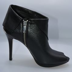 The Ultra-High Heel Measures Over 4 Inches, Making It A Statement Piece For Any Outfit. The Peep Toe And Bootie Style Combine For A Unique And Fashionable Look. The Upper Material Is Made Of Leather, Ensuring Durability And Comfort. New In Box. Fitted Leather Booties With Closed Toe, Leather Lined Round Toe Heels For Night Out, Formal Open Toe Boots With Wrapped Heel, Open Toe Leather Booties For Night Out, Leather Open Toe Booties For Night Out, Chic Leather Open Toe Booties, Designer Open Toe Boots For Formal Occasions, Elegant Open Toe Leather Boots, Formal Open Toe Leather Boots