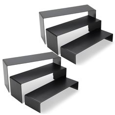 two black and white shelves sitting next to each other