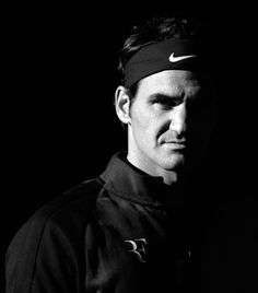 black and white photograph of a man with headband on looking off to the side