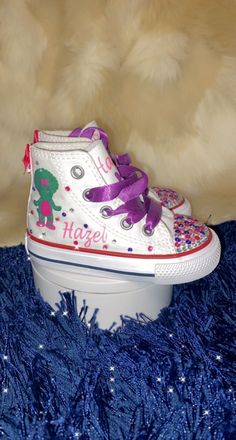 Converse Only at the moment  price will include shoe!  Make sure to include all details you want added on shoe  Name: colors: theme: size: age:  low top/high top  Add bling? Yes/No Baby/Toddler = #C sizes White High-top Sneakers For Birthday, Pink Lace-up Sneakers For Birthday, Fun Hand Painted High-top Custom Sneakers, Pink Low-top Sneakers For Birthday, Fun Hand-painted High-top Sneakers, Fun High-top Sneakers For Birthday, Cute High-top Sneakers For Birthday, Customizable Multicolor High-top Sneakers, Fun Hand Painted High-top Sneakers