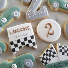 some cookies are decorated with cars and numbers on them, as well as the number two