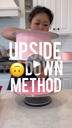 a woman standing in front of a cake with the words upside down method on it