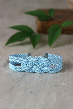 Delicate light blue summer knot bracelet created from decorative twisted rope and clasp in silver tone metal. Perfect jewelry for everyday wear! Length: 17 -18 cm + 6 cm of chain (If you need other size,please,let me know). A wonderful jewelry and a great gift! I made it in a smoke-free and pet-free invironment. Other bracelets of my shop you can see here: https://www.etsy.com/shop/NaTavelli?section_id=13470528 Thanks for your visit! Nautical Blue Bracelets As A Gift, Nautical Blue Bracelets For Gifts, Adjustable Blue Nautical Jewelry, Light Blue Bracelet, Bracelet Knot, Sailor Knot Bracelet, Navy Adjustable Nautical Bracelet, Nautical Rope Bracelet, Sailor Knot