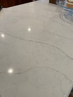 a white marble counter top in a kitchen