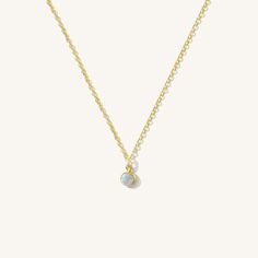 Elevate your style sustainably with our Tiny Opal Necklace - a dainty piece made for everyday wear. Made with gold filled, this necklace is tarnish-resistant and gentle on sensitive skin, making it your favorite piece to wear all day, every day. Dress it up for a night out or dress it down for a coffee run, and you'll look and feel your best, no matter the occasion. Opal is October's birthstone, so this makes the perfect gift for the October baby. DETAILS Necklace length: 14" with 2" extender 1