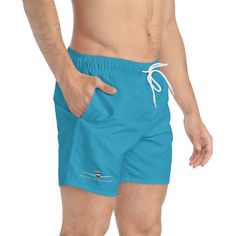 Rockwell Commander Swim Trunks - Turquoise. Nothing can swoosh down the summer heat like a dive into the water.  .: Material: 100% polyester .: Extra light fabric (3.54 oz/yd² (120 g/m .: Fast-dry fabric .: Mesh basket lining  .: Mesh-lined side pockets .: Printed care label inside .: Drawstring waist Blue Sports Swimwear For Summer, Light Blue Swim Trunks For Summer Beachwear, Light Blue Swim Trunks For Summer, Moisture-wicking Blue Swimwear For Beach Season, Light Blue Beachwear Swim Trunks For Summer, Blue Moisture-wicking Swimwear For Beach Season, Blue Moisture-wicking Swimwear, Casual Light Blue Swimwear For Summer, Light Blue Casual Swimwear For Summer