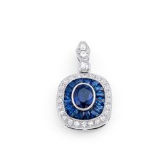 0.78-carat center, 0.50-carat sides blue sapphire, and diamond pendant necklace in 900 platinum. Rings Fancy, Mens Diamond Jewelry, Pendants Diamond, Platinum Pendant, Cocktail Fashion, Necklaces Diamond, Gemstone Diamond Ring, Diamond Pendants, Deco Blue