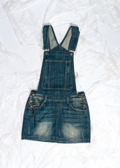 Y2K vintage dungaree skirt you didn't know your wardrobe needed. Features: - seven pockets - button closure - 95% cotton, 5% elastane Every item we manage is repaired and cleaned as necessary, ensuring it arrives to you in top condition. Size: S / US 4 / UK 8 / IT 40 Other size info: Labelled size: 27 Measurements:  waist (seam to seam): 36 cm / 14.0" length (max): 87 cm / 33.9" Fabric: cotton 95%, elastane 5% Care: Machine wash separately Cheap Vintage Denim Mini Skirt, Y2k Denim Blue Mini Skirt With Pockets, Vintage Cotton Mini Denim Skirt, Y2k High-rise Denim Blue Mini Skirt, Vintage Denim Blue Mini Skirt, Style Salopette, Y2k Mini Skirt, Denim Dungaree, Dungaree Skirt