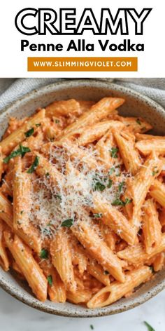 creamy penne alla vodka in a bowl with parmesan sprinkles