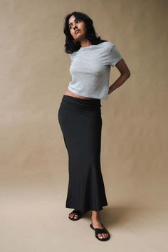 Geel verve skirt in black jersey. the verve a full length bias skirt with a hidden elastic waistband. a simple but strong statement piece. fits true to size. model is wearing a size small.    40 inch length.    100% polyester.    pipe and row Bias Skirt, The Verve, Black Jersey, Crew Neck Tee, Long Skirt, Heathers, The Row, Heather Grey, Full Length