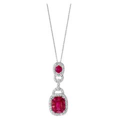 3.5 Carat Natural Burma Ruby and Diamond Pendant Necklace 18 Karat Gold This spectacular Pendant Necklace consisting of natural Burma ruby. One Emerald shape ruby piece in the center which look like a single piece but in fact there is a center single stone which is surrounded by princess cut small ruby by leisure . The Ruby is surrounded by approximately 1.5 Carats of brilliant cut diamonds VS quality. Excellent craftsmanship! Looks like one large piece . 18 Karat Yellow gold 8 gm Burma Ruby is Formal Ruby Necklace With Halo Setting, Formal White Gold Ruby Necklace, Classic Formal Necklace With Lab-created Ruby, Ruby Diamond Pendant, Ruby Jewelry Necklaces, Gold Slides, Platinum Rose Gold, Ruby Pendant, Red Jewelry