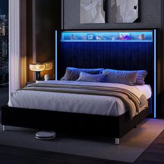 a bedroom with a bed, night stand and two lamps