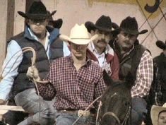 a group of men riding on the backs of horses