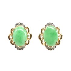 Surprise your favorite lady (or treat yourself) with these gorgeous earrings! These exquisite 14 karat solid yellow gold clip-on earrings are each prong-set with an oval cabochon green chrysoprase stone, each measuring 13.83 millimeters long by 10 millimeters wide by 6.19 millimeters deep, and each weighing an estimated 6.03 carats, for a total chrysoprase weight of 12.06 carats. Each earring is accented with 10 round-cut natural diamonds set in white gold, each measuring 1 millimeter in diamete Vintage Inspired Jewelry, All Gems, Gold Clips, Inspired Jewelry, On Holiday, Earrings Vintage, Gorgeous Earrings, Oval Cabochon, Gold Charm