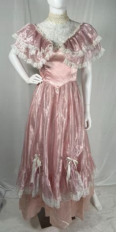 Vintage 70s/80s Gunne Sax Pink Princess Dress by Jessica McClintock - Size 5, see measurements below and in pics for best fit - Lace chest and neck - ties in back - has cute bows in front ruched skirt - has lining and netting underneath - Ruffle collar around shoulders - zips in back, buttons up neck - great vintage condition with some discoloration from age (neck, pits, and small spots on bottom of skirt) Approximate flat measurements: - Pit to Pit: 15.5" - Waist: 12" - Length: 54.5" Material: Vintage Short Sleeve Dress For Costume Party, Pink Vintage Dress For Costume Party, Vintage Pink Costume Dresses, Vintage Dress With Fitted Bodice For Costume Party, Fitted Short Sleeve Vintage Costume Dress, Fitted Short Sleeve Vintage Dress For Costumes, Fitted Vintage Victorian Dress, Vintage Dress With Fitted Bodice, 1970s Style Fitted Vintage Dress For Vintage Events