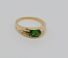 This is a 14K Yellow Gold ring with channel set green stone, oval shape, Modern, stone approximately 8 x 10 mm, Ring Size 8, Weight 4.1 grams. Stock # BB93R26 This listing contains photographs of the actual item you will receive. Our items are in excellent condition with little or no signs of wear and many are one of a kind pre-owned estate finds. Please look closely at the pictures in this listing as they are part of the product description. Please read the description, as any imperfections or Green Stone Ring, Green Stone Rings, Channel Set, Boston Ma, Green Stone, Stone Ring, Yellow Gold Rings, Oval Shape, Stone Rings