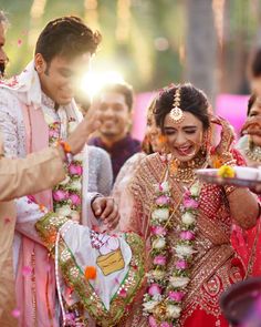 the bride and groom are getting ready to throw confetti on each other at their wedding