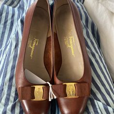 Authentic Gorgeous Pair Of Salvatore Ferragamo Vara Pumps # 47264 Size:7 1/2 Aa Color:In Brown Leather Color Is Perfect Neutral Will Go With Anything..So Beautiful And Always A Classic . Incredibly Stylish. These Sandals Are Not Brand New But They Do Have The Original Msrp Tags Still On Bottom Of One Shoe! Gorgeous Shoes!!!! Final Sale As Is Elegant Flat Brown Leather Shoes, Classic Flat Heels In Calf Leather, Classic Flat Calf Leather Heels, Elegant Flat Calf Leather Heels, Salvatore Ferragamo Shoes, Ferragamo Shoes, Gorgeous Shoes, So Beautiful, Salvatore Ferragamo