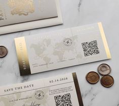 two different types of wedding stationery on a marble table with gold foil and coins