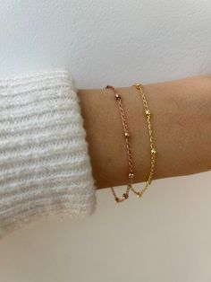 This beautiful little bracelets is perfect for a minimalist look! It is available in both gold and rose gold-filled. D E T A I L S  *18k Gold filled/Rose gold filled satellite chain - 1.6mm curb with 2.7mm ball  *Gold fill is a wonderful alternative to real gold and unlike gold plating does not rub off.  *Hall marked gold filled spring ring clasp closure. S I Z I N G *  H E L P Choose the length from the drop down menu. Use the length guide as a reference. If unsure about the size you need  choo Dainty Rose Gold Bracelet, 14k Gold Filled, Dainty 14k Gold Filled Rose Gold Bracelet, Dainty Rose Gold 14k Gold Filled Bracelets, Delicate Rose Gold Satellite Chain Bracelet, Dainty Rose Gold Bracelets With Satellite Chain, Simple 14k Rose Gold-filled Bracelets, Dainty Rose Gold Bracelet With Satellite Chain, Simple Rose Gold 14k Gold-filled Bracelets, Adjustable Rose Gold Bracelet With Satellite Chain