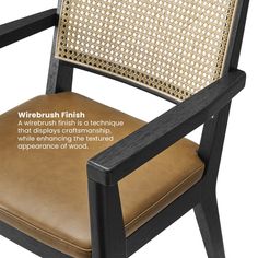 the back of a chair with leather upholstered seat and wood frame, which features wicker finish