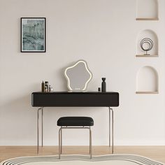 a white and black desk with a mirror, stool and shelf on the wall behind it