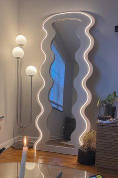 Neutral aesthetic. Cozy home decor. Wavy mirror. LED aesthetic. LED mirror. Small Aesthetic Mirror, Floor Mirror Aesthetic, Apartment Aesthetic Led, House Decor Eclectic, Curvy Mirrors, Apartment Neutral, Funky Apartment Decor, Funky House Decor, Warm Apartment Aesthetic