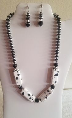 SOLD Necklace & Earrings set - Large white glass beads with black spots, black faceted spacers & black and silver toned rondelles, silver accents. Necklace is approximately 22 inches long. Adjustable Black And White Beaded Jewelry, Adjustable White Jewelry With Black Beads, Black And White Round Bead Jewelry, Black Spot, Silver Accents, Necklace Earring Set, Large White, Glass Jewelry, Necklace Earrings