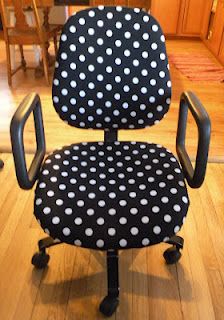 a black and white polka dot office chair