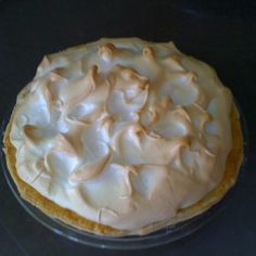 a pie sitting on top of a pan covered in frosting