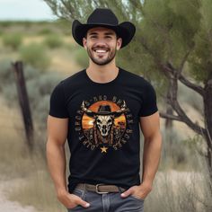 Get ready for some wild Midwestern fun with this Country Longhorn Spirit Shirt! Made for those who dare to be different, this unique shirt features a vibrant and eye-catching design that showcases the charm of the real Country Western Vibes. Whether you're a rodeo enthusiast, a cowboy at heart, or just love finding a shirt that truly stands out, this one-of-a-kind piece is perfect for adding a touch of country western to your wardrobe. Crafted with comfort in mind, this shirt is made from high-q Black Short Sleeve Western Tops, Black Short Sleeve Adventure Shirt, Black Short Sleeve Shirt For Adventure, Black Short Sleeve Western Style Top, Rodeo Short Sleeve Shirt, Pre-shrunk, Black Cotton Western T-shirt, Black Western Style Cotton T-shirt, Midwest Style, Cowboy Fashion