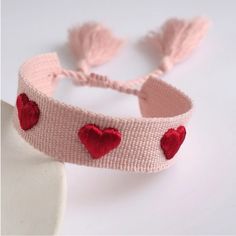 Pink With Hearts Boho Woven Tassel Bracelet Boho-Chic Style: Add A Touch Of Boho Flair To Your Sweet Stack With This Pink & Red Wrap Embroidery Rope String Bracelet. Versatile Accessor: This Bracelet Can Be Worn With Casual Or Dressy Outfits, Making It A Great Addition To Your Jewelry Collection. Comfortable Fit: The Soft Rope String Material Ensures A Comfortable Fit, Perfect For All-Day Wear. Perfect Gift: Surprise Your Loved Ones With This Personality Jewelry Gift For Women And Girls. It's A Tory Burch Bracelet, Stretchy Beaded Bracelet, Bohemian Style Jewelry, Blue Beaded Bracelets, Stamped Bracelet, Tassel Bracelet, String Bracelet, Silver Bangle Bracelets, Sterling Silver Bangles