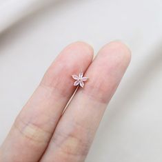 ⇢⇢ PLEASE READ BEFORE PURCHASING ⇠⇠ ✧✧ This listing is for ONE piece only ✧✧ PLEASE BE AWARE of your own ear piercing size!! Everyone has different sizes and shaped ears, with different gauge sizes, so our suggestion may NOT be for everyone. 💜 Item Details 💜 ✧ 1 Piece ✧ Thickness: 16 Gauge (1.2mm) ✧ Top Size: 5mm ✧ Material: Surgical Steel ✧ Externally Threaded ✧ For: Cartilage, Tragus, Helix, Conch ✧ Ball Back (4mm) ✧ If you wanted a 3mm ball end (Silver color only), please leave me a note wh Dainty Single Flower Shaped Earring, Minimalist Flower Shaped Pierced Jewelry, Rose Gold Single Flower Earring, Rose Gold Flower Shaped Single Earring, Rose Gold Flower-shaped Single Earring, Flower Cartilage Earrings For Pierced Ears As Gift, Flower Shaped Cartilage Earrings For Gift, Gift Flower Cartilage Earrings, Tiny Rose Gold Flower Shaped Jewelry