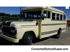 an old school bus parked in a parking lot