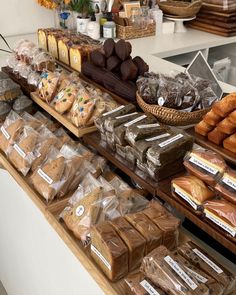 breads and pastries on display in a bakery