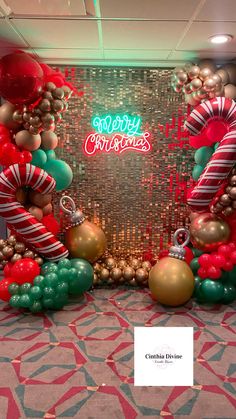 the balloon arch is decorated with candy canes and lollipops for christmas