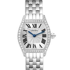 Cartier Tortue White Gold Diamond Ladies Watch WA501011. Manual winding movement. 18K white gold case 24.0 x 30.0 mm. Octagonal crown set with the diamond. Diamond lugs. 18K white gold bezel with factory Cartier diamonds. Scratch resistant sapphire crystal. Silver dial with Roman numerals. Blue sword shape hands. Secret signature at VII. 18k white gold bracelet with double deployant hidden clasp. Fits 6 1/4" wrist. Cartier Diamond Watch With Round Dial, Cartier Diamond Watch With Diamond Accents, Formal Diamond White Watch With Metal Dial, Cartier Diamond Watch With Diamond Hour Markers For Anniversary, Classic Diamond White Watch With Metal Dial, Cartier White Gold Diamond Watch With Round Dial, Classic Silver Diamond Watch With Diamond Hour Markers, Timeless Diamond Watch With Metal Dial For Anniversary, Diamond Wedding Watch With Subdials