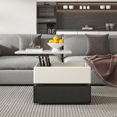 a modern living room with grey couches and white table in the centerpieces