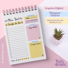 a spiral notebook with spanish words and a plant next to it on a pink and white background