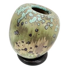 This high-quality studio ceramic art vase was created by the German ceramist Hanne Wydra-Jantz during the 1980s who established her own pottery workshop in Olsberg-Gevlinghausen in 1978. The object features an impressive ceramic glaze. It comes with its own ceramic standing ring, which allows the vase to be freely positioned at different angles and to arrange a sculptural ensemble.   Additional Dimensions:  - Vase Height: 18 cm - Vase Diameter: 15.5 cm - Standing Ring Diameter: 13.5 cm - Ring He Pottery Workshop, Ceramic Glaze, The 1980s, Ceramic Art, Glaze, Germany, Things To Come, Vase, Sculpture