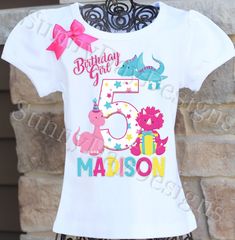 A fun, colorful dinosaur themed birthday shirt personalized with your child's name and age. All shirts are 100% cotton.  I use a professional heat press to transfer the image, NOT a home iron.  All shirts are embellished with a bow.  I will personalize it with your child's name and age for no additional cost.  The puffy sleeve tee comes in sizes 12 month - size 12 . I also carry the same brand shirt in a tank top style as well as long sleeved.  I also have Carter's bodysuits in sizes newborn - 2 Girls Dinosaur Birthday, Heat Press Shirts, Girl Dinosaur Birthday, Disney Princess Birthday, Girl Dinosaur, Bday Girl, Dinosaur Birthday Party, Birthday Girl Shirt, Brand Shirts