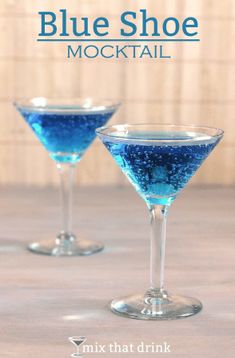 two martini glasses filled with blue liquid