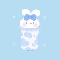 an animal with a bow on it's head in a blue cup filled with bubbles