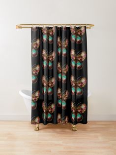 a colorful butterfly shower curtain hanging on a wall