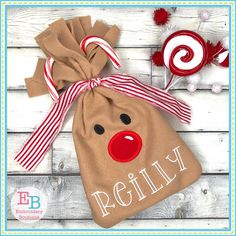 a brown bag with a red nose and candy canes