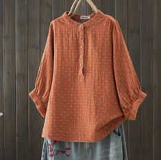 This blouse is crafted from double-layer cotton gauze, offering a lightweight and breathable feel. This blouse also has 3/4 sleeves adding a touch of elegance and comfort. Orange Long Sleeve Blouse With Relaxed Fit, Orange Relaxed Fit Long Sleeve Blouse, Orange Long Sleeve Cotton Blouse, Cotton Blouse With 3/4 Sleeves For Daywear, Spring Cotton Blouse With Half Sleeves, Spring Half-sleeve Cotton Blouse, Spring Cotton Blouse With 3/4 Sleeves, Fall Cotton Short Sleeve Peasant Top, Fall Cotton Blouse With Half Sleeves