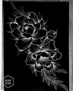 a black and white drawing of flowers on a piece of paper